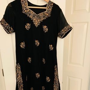 Black salwar dress with matching Dupatta.